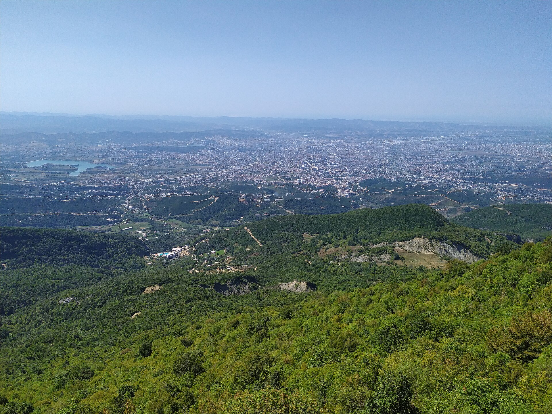 Tirana seen from Mount Dajti, mist in the valley and wooded hills
